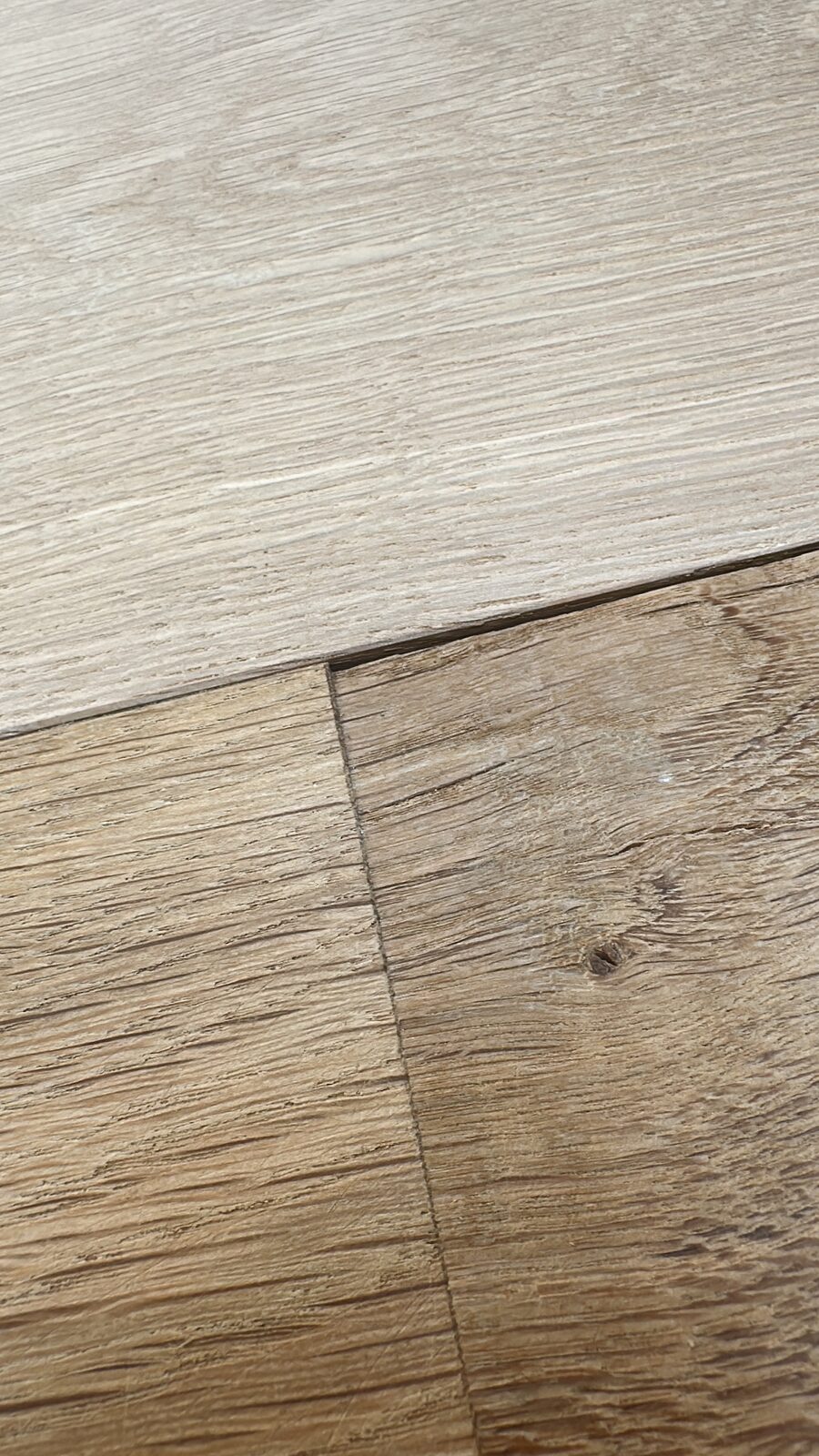 Raw oak boards next to freshly sanded oak โ the transformation in one frame